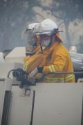 Firefighters work in smoky conditions