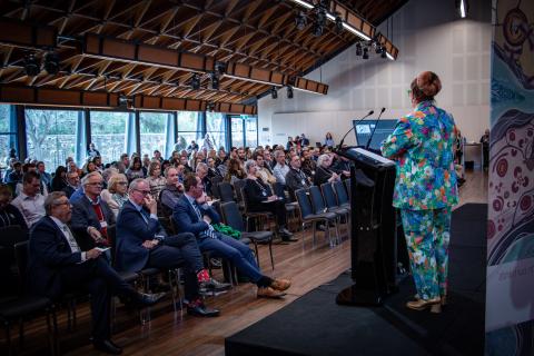 Ariella Helfgott speaking to conference room
